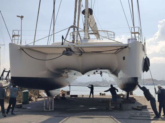 Catamaran on stands ready for underwater work – SailorOne