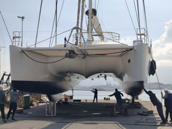 Catamaran on stands ready for underwater work – SailorOne