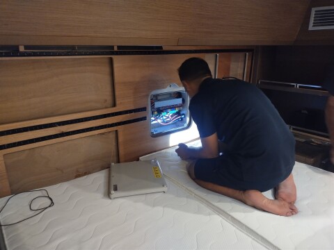 Technician working on a yacht electrical panel – SailorOne