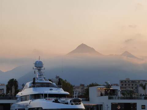Motor yacht at a berth in Palermo at sunset – SailorOne