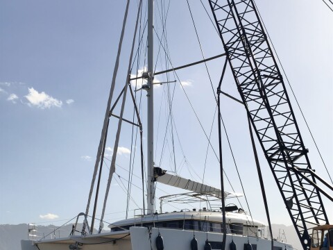 Sailing catamaran lifted by crane during haul-out in Palermo – SailorOne