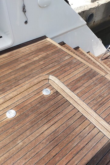The same teak deck after restoration – SailorOne