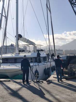 Yard team preparing a catamaran for lifting – SailorOne